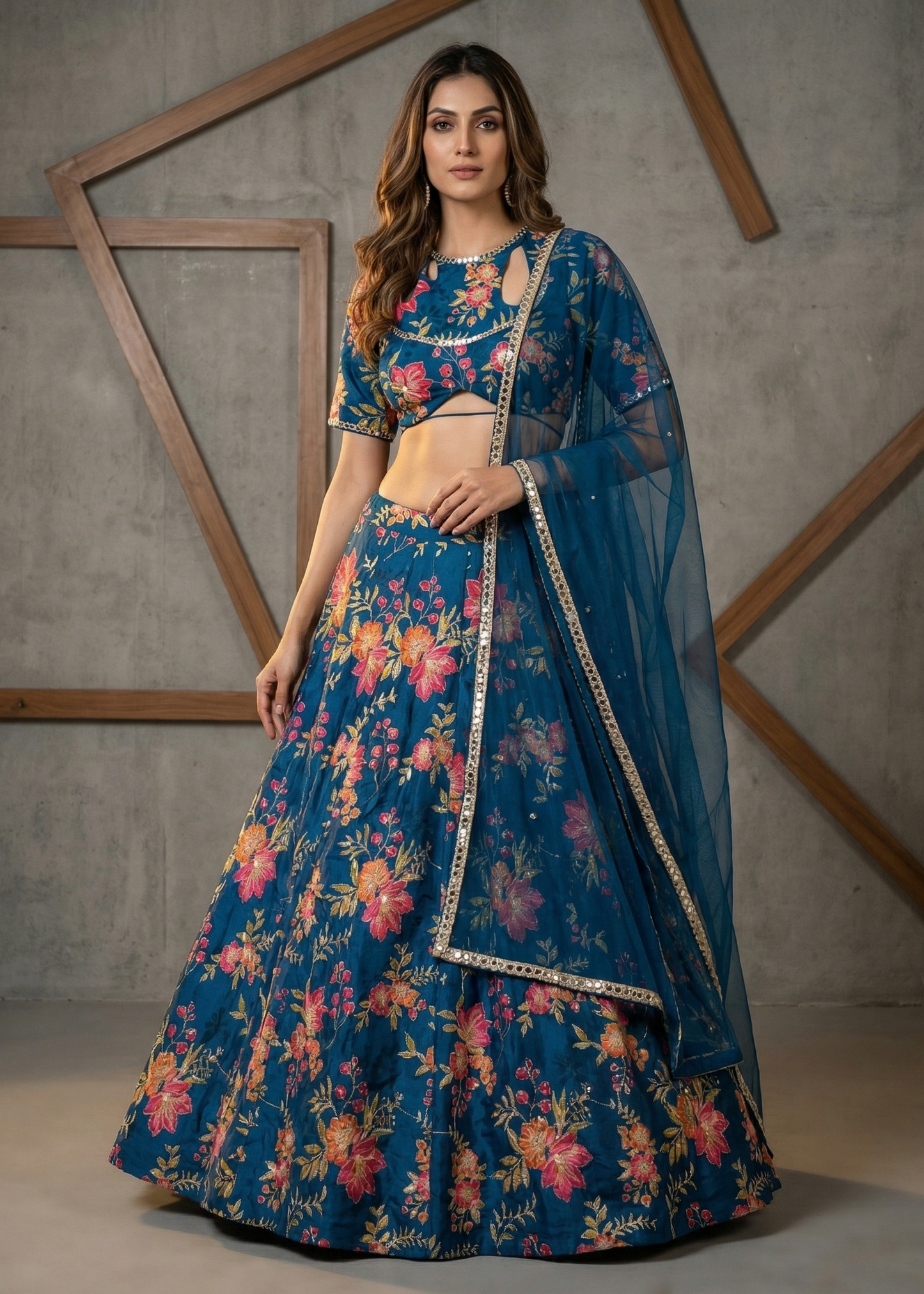 Woman wearing a blue floral traditional outfit with a gray background