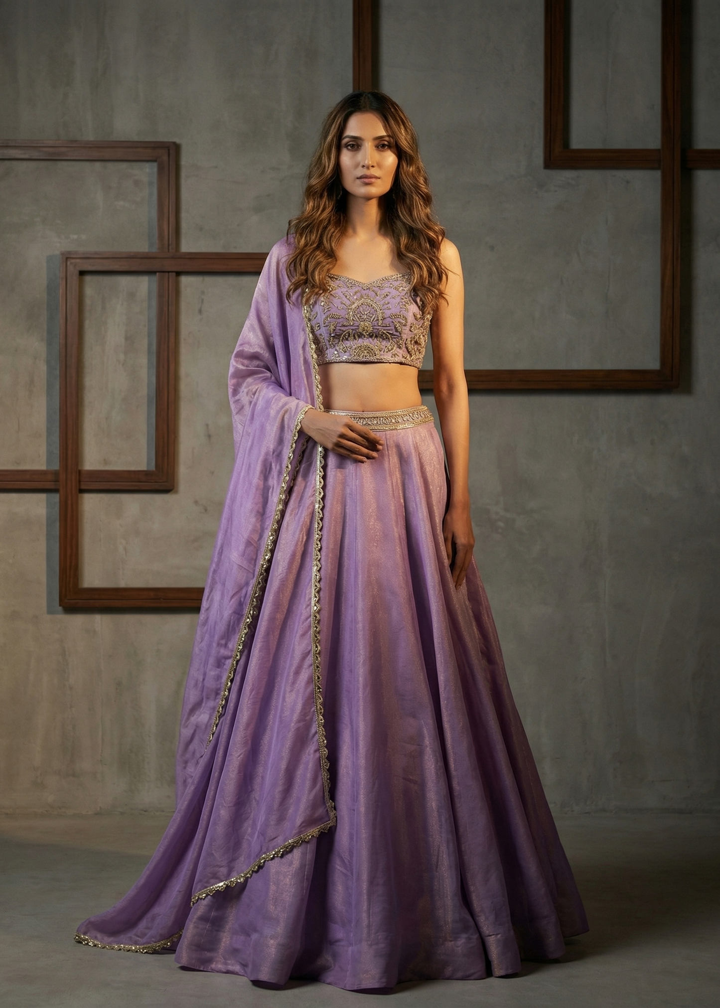 Woman wearing a purple traditional outfit with a gray background