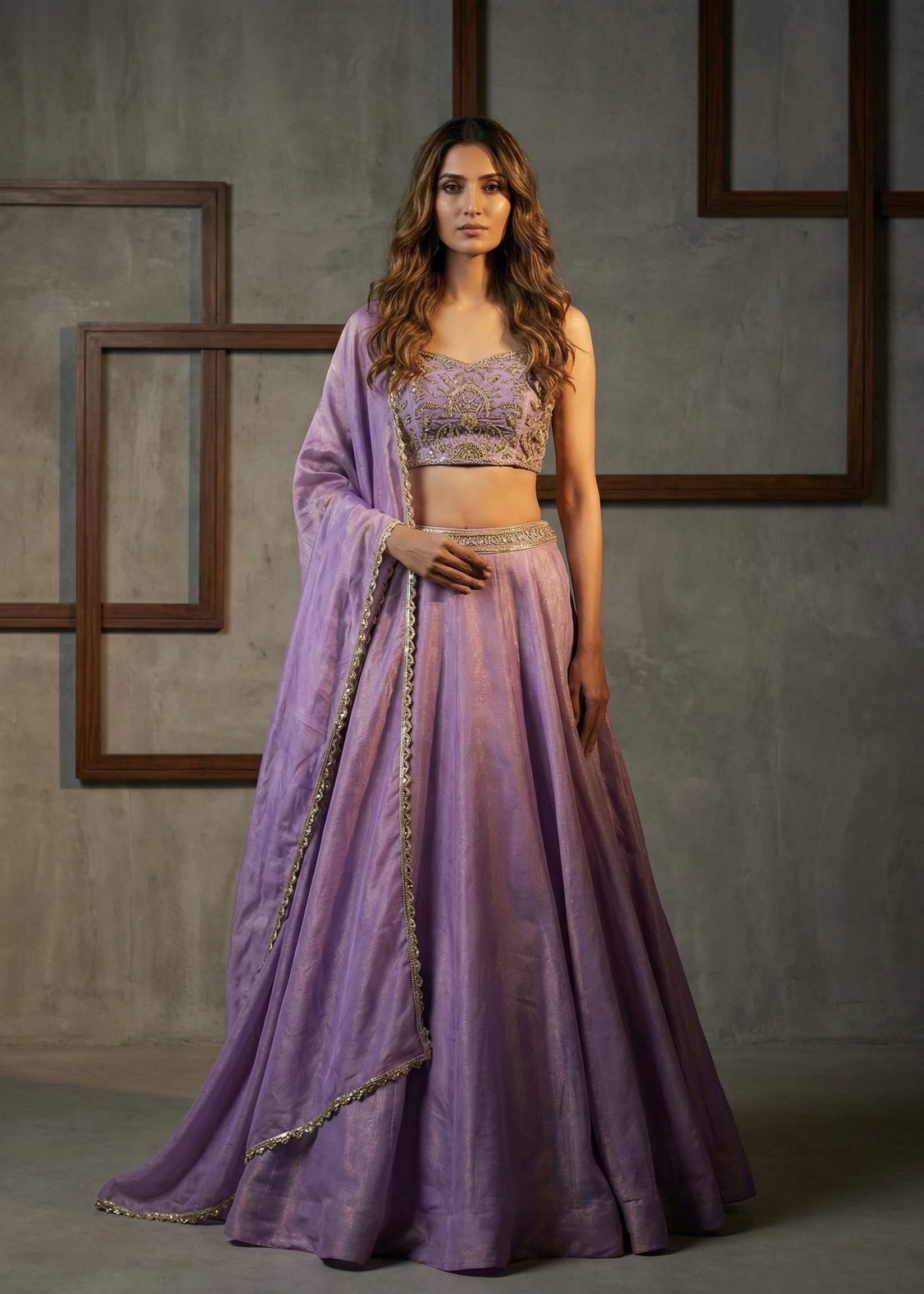 Woman wearing a purple traditional outfit with a gray background