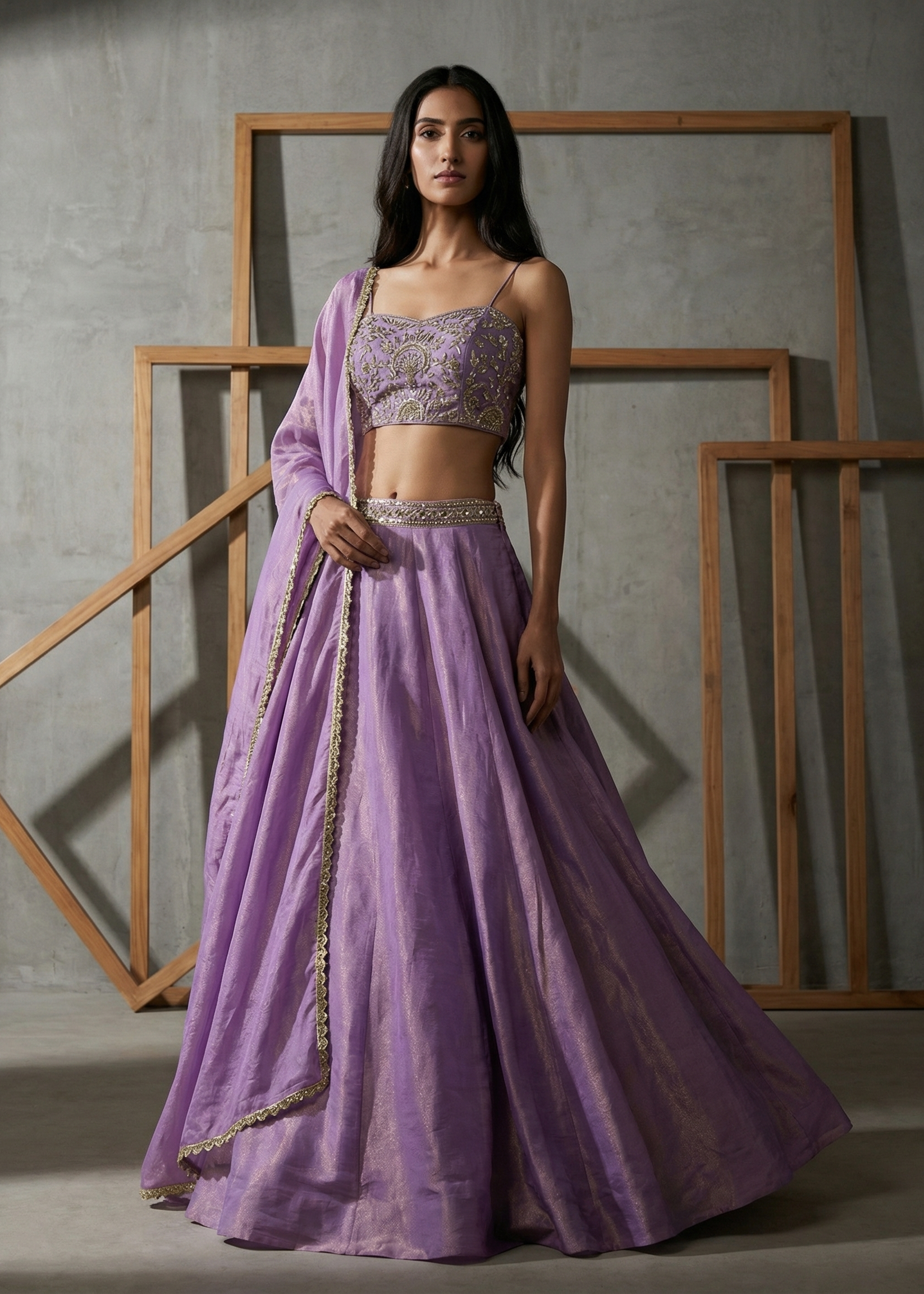 Woman wearing a purple traditional outfit with a gray background