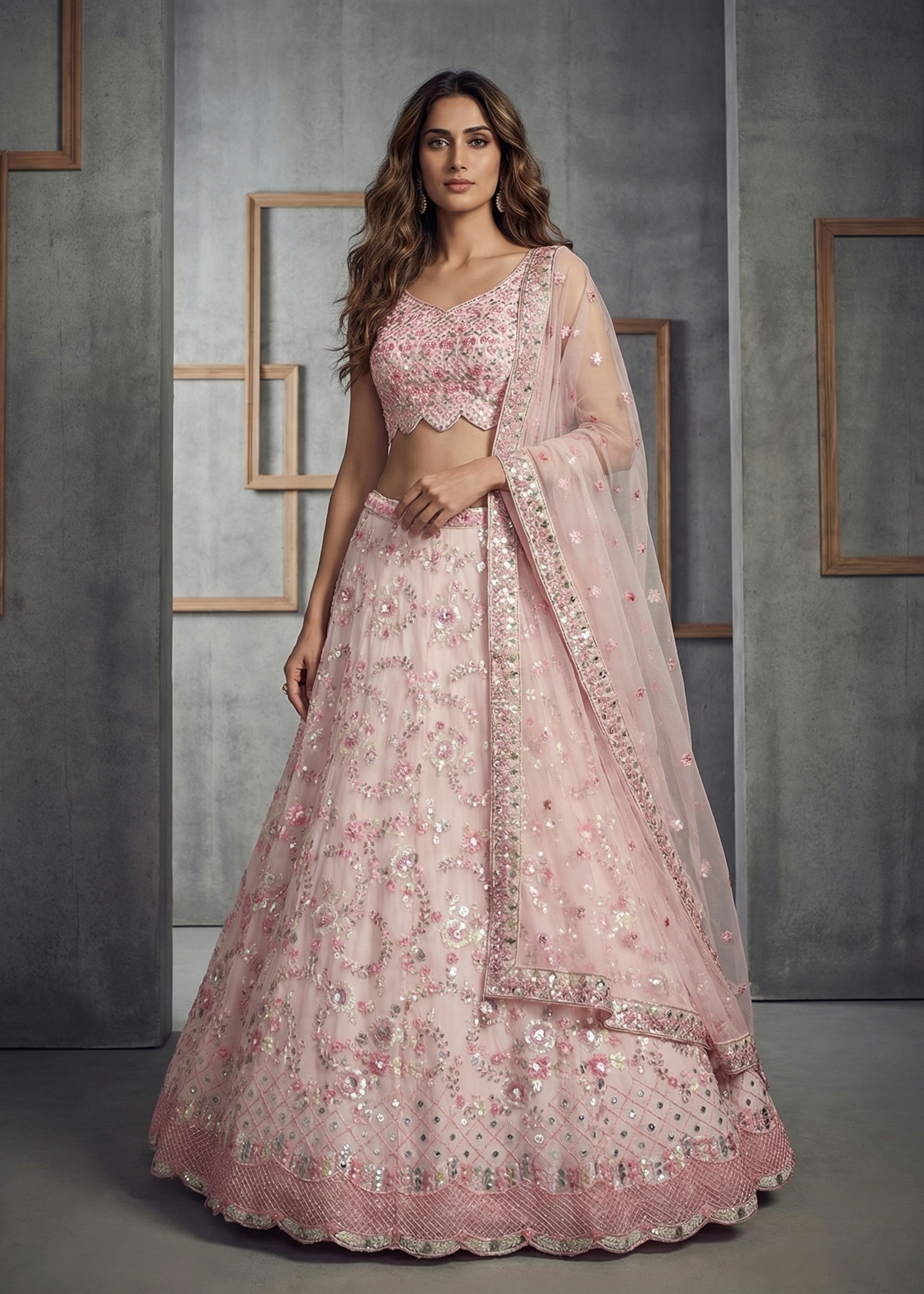Woman wearing a pink embroidered traditional outfit against a gray background