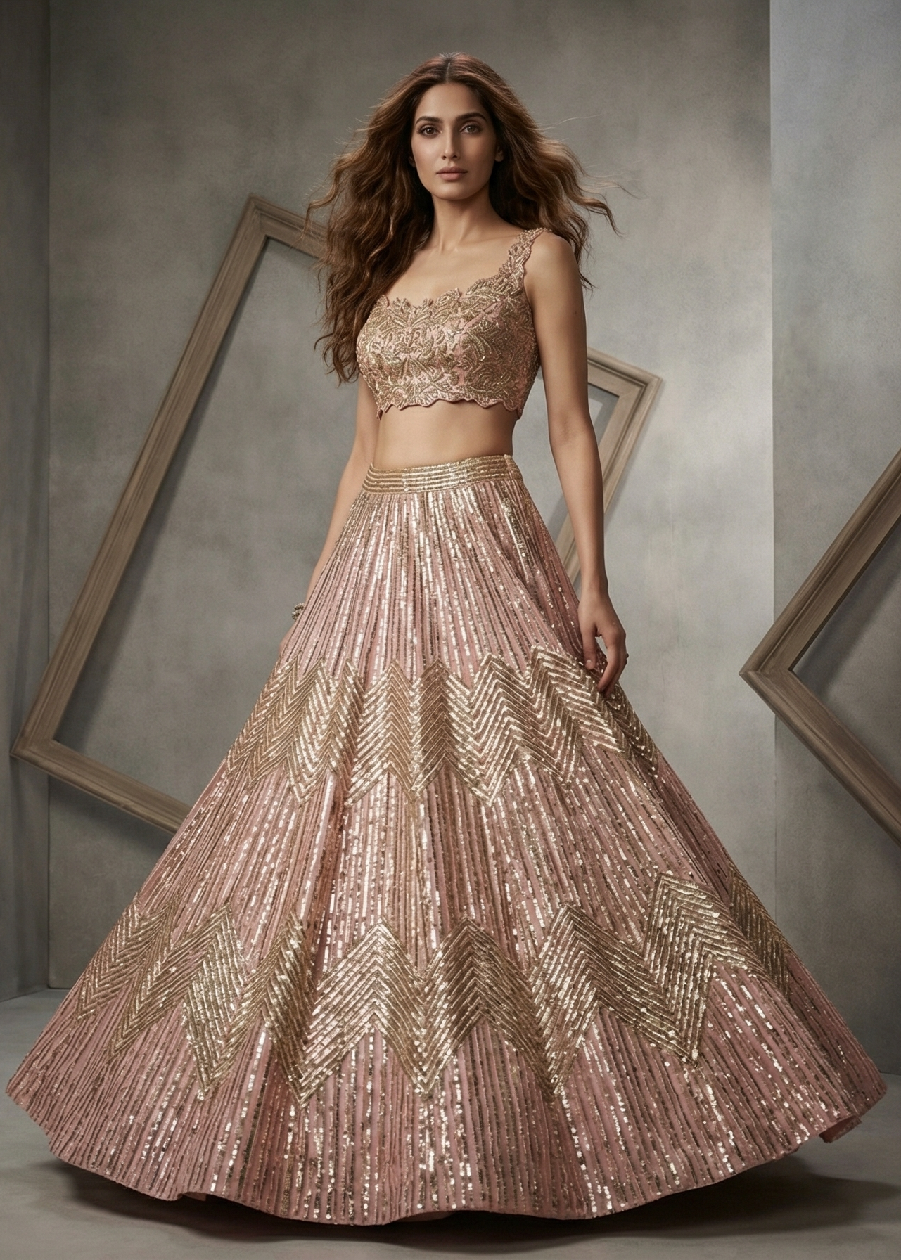 Woman wearing a sparkling two-piece outfit in a room with geometric wall frames.