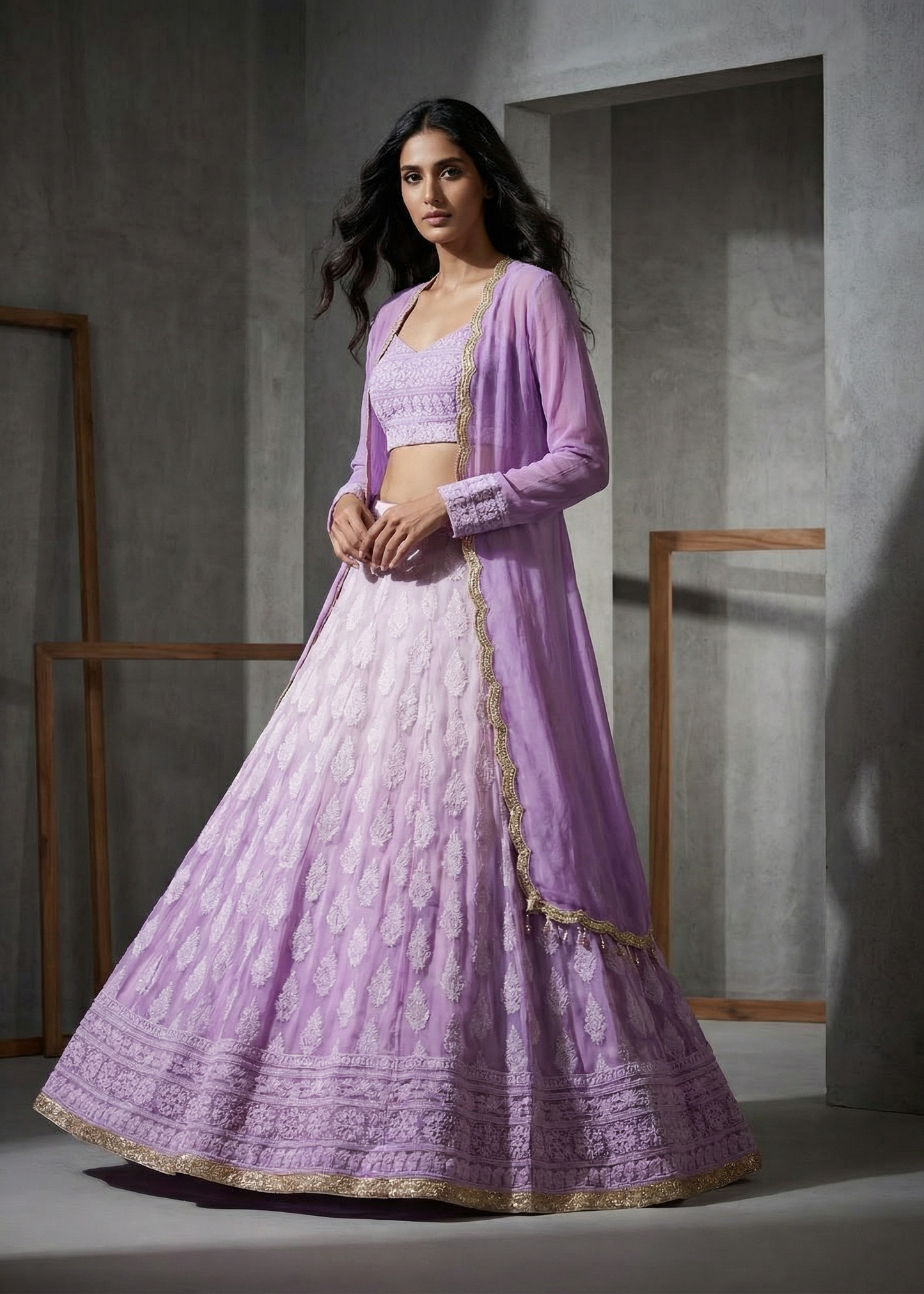 Woman wearing a lavender traditional outfit with a plain background
